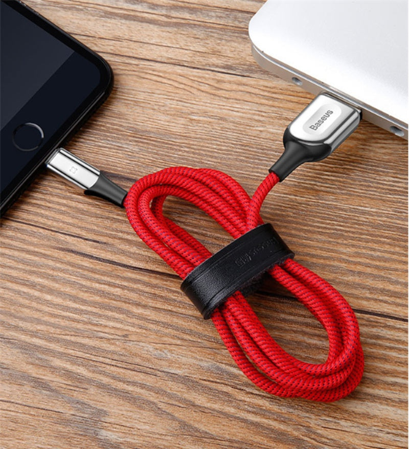Red X Light Data Cable Smart Charging Indicator coiled with a black organizer strap.