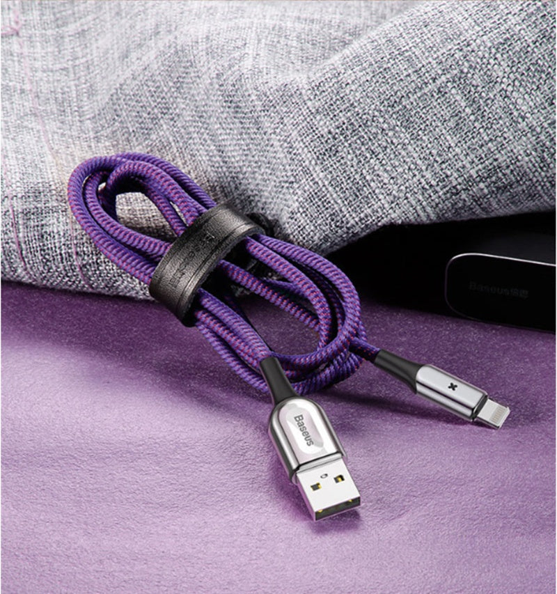 Tangle-free purple X Light Data Cable Smart Charging Indicator with convenient storage strap.