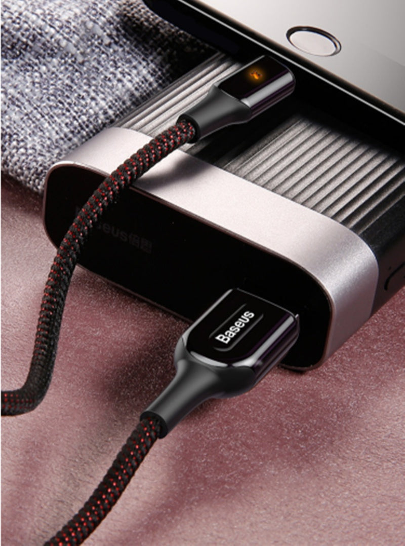 Close-up of the X Light Data Cable Smart Charging Indicator plugged into a portable power bank.