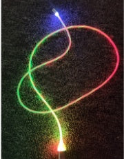 Luminous green Magnetic Circular Magnetic Streamer Charging Cable neatly coiled next to its magnetic charging tips.